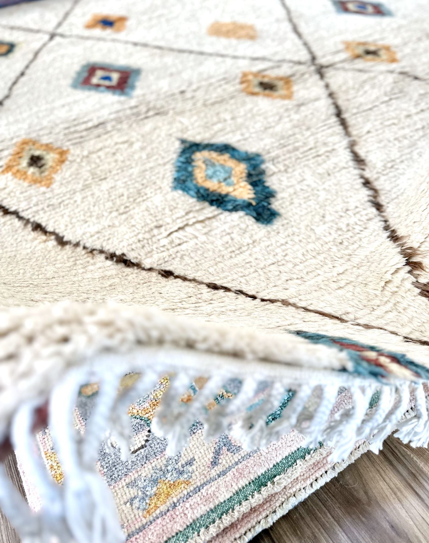 Tassel fringe on 8 x 10 hand knotted Moroccan rug.