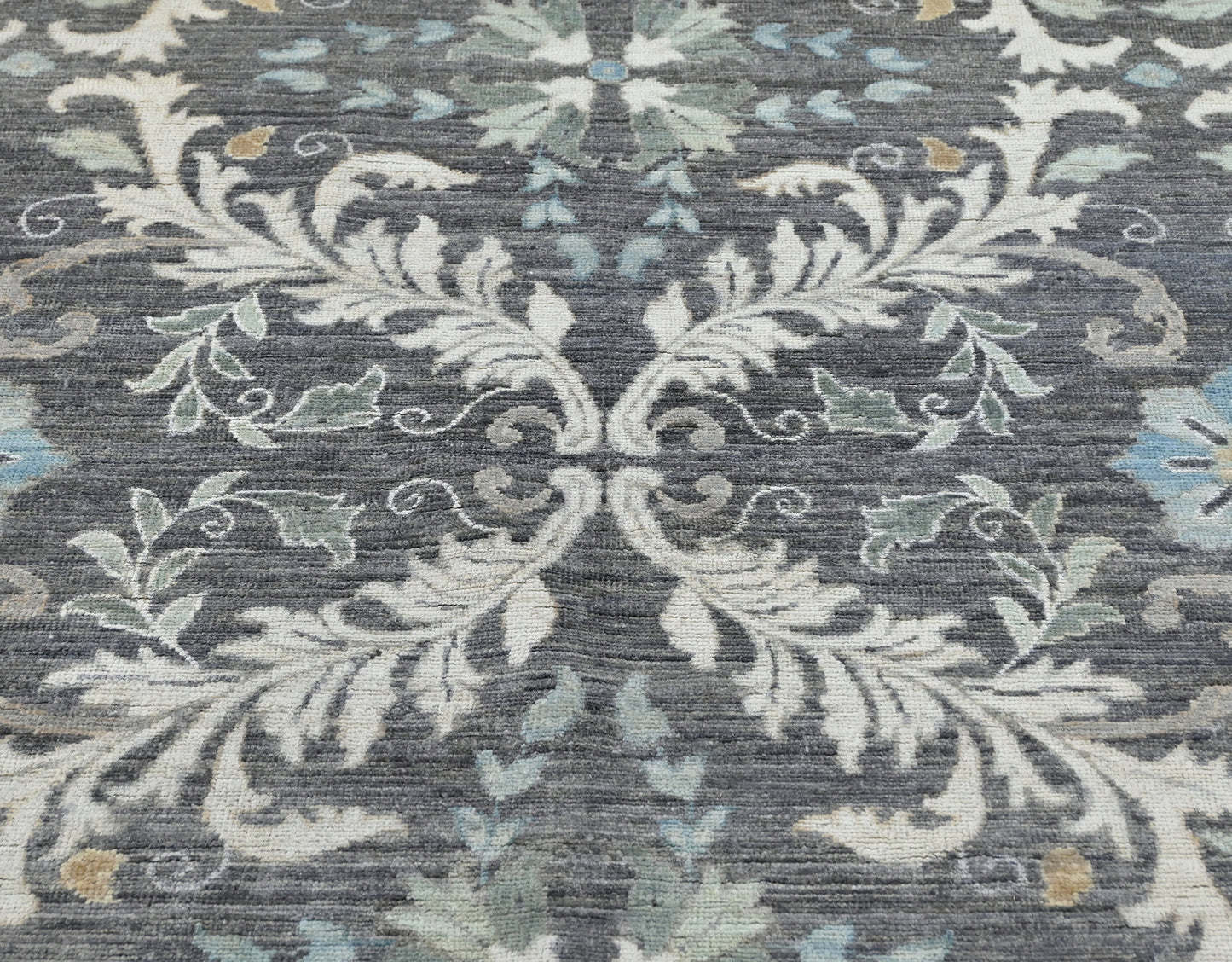 400 Char Luxury hand-knotted gray 8 x 10 wool rug with a flowing pattern and accents of blue and cream.