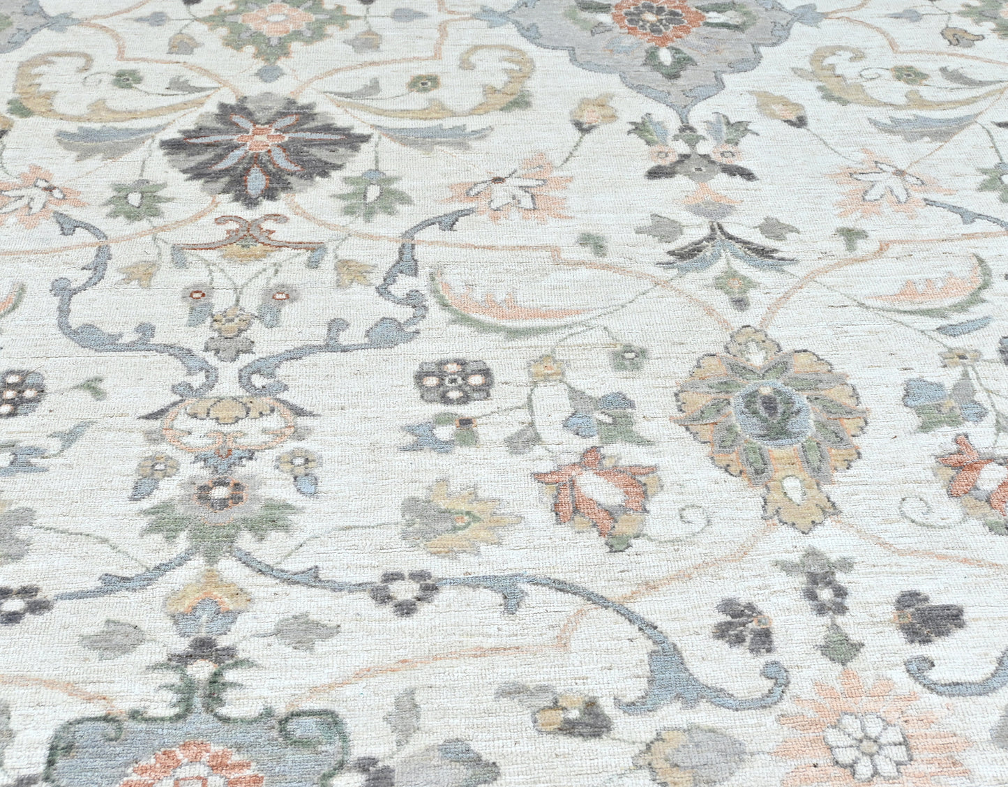 Luxury designer rug, neutral colors with a softly flowing pattern. Detailed border, size 10 x 14.