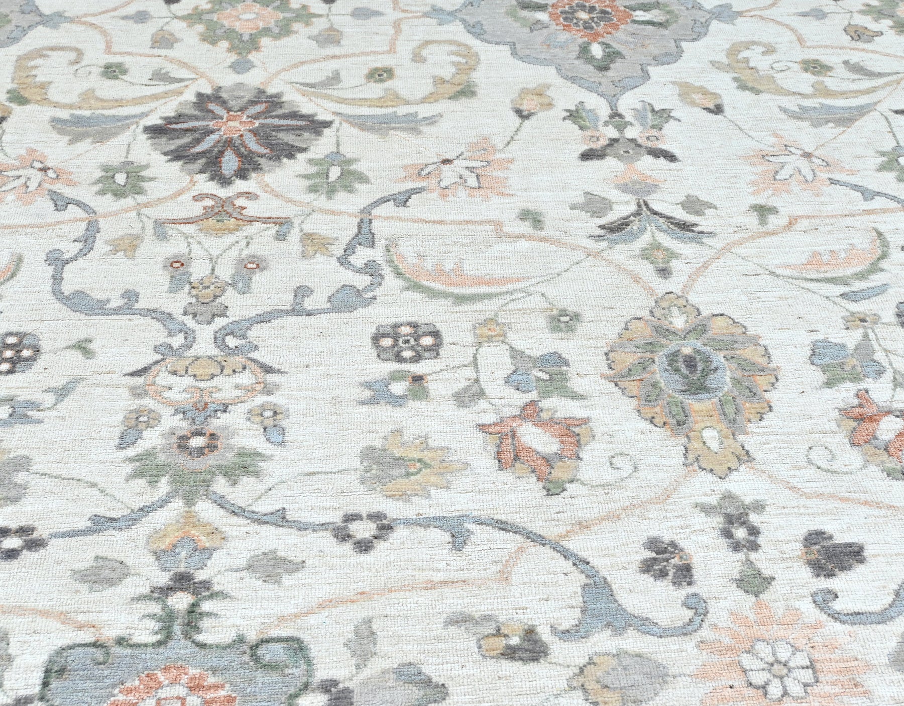 Luxury designer rug, neutral colors with a softly flowing pattern. Detailed border, size 10 x 14.