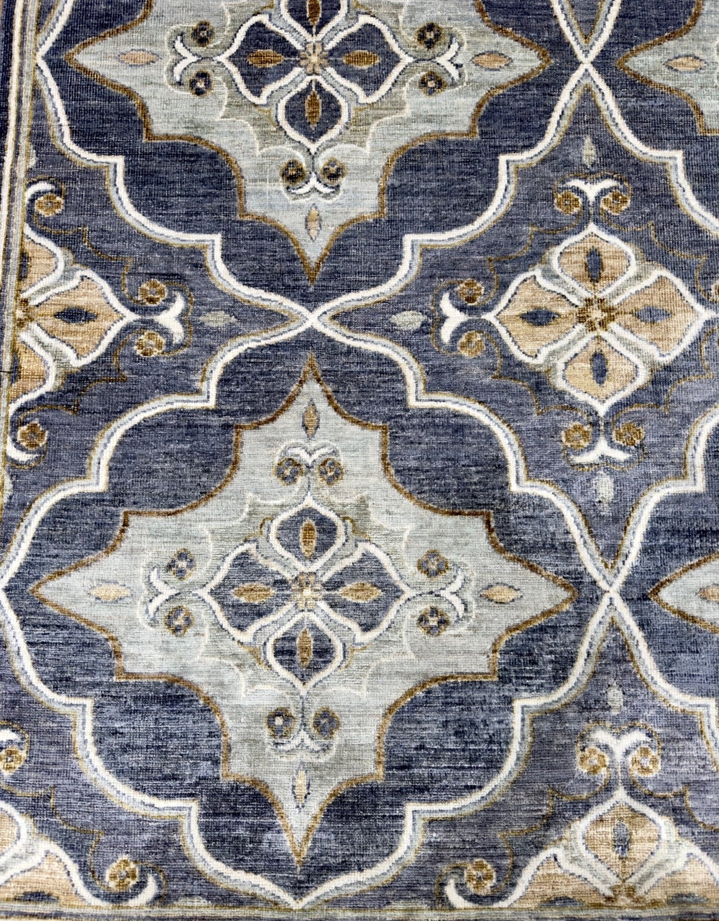 New traditional gray hand-knotted rug with large scale, repetitive pattern with accents of seafoam, brass, and tobacco brown. Size 5 x 7