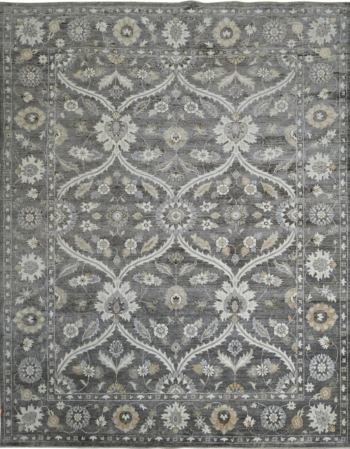 Luxury handknotted 8 x10 woolrug. Gray overall color with accents of ivory, beige, and camel. Soft flowing pattern with a border.