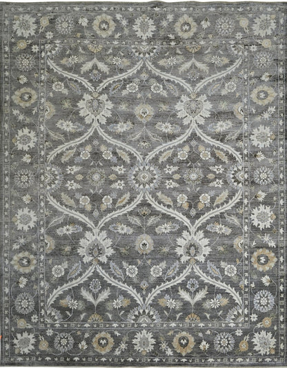 Luxury handknotted 8 x10 woolrug. Gray overall color with accents of ivory, beige, and camel. Soft flowing pattern with a border.