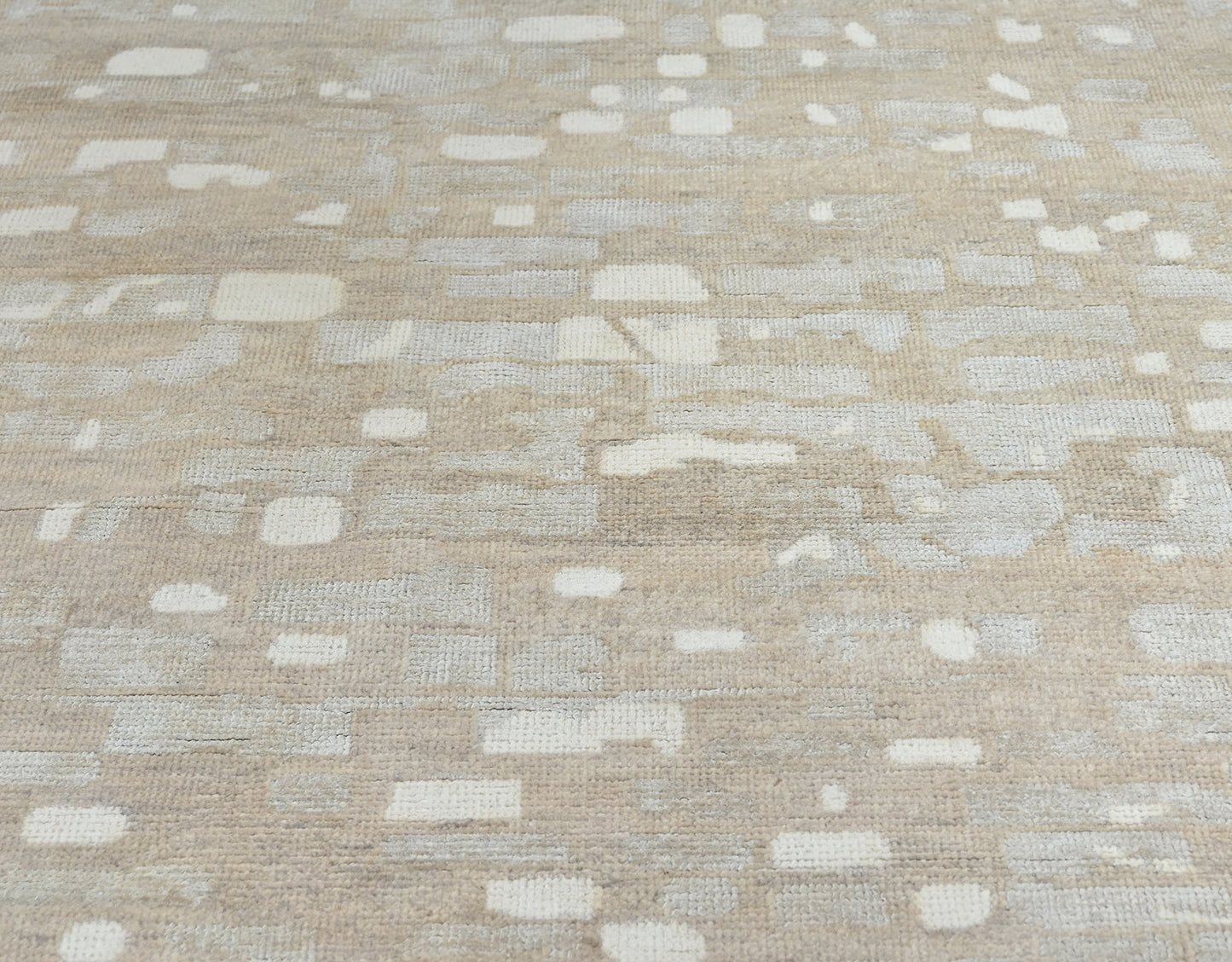 Modern beige and gray handknotted rug with wool and silk.
