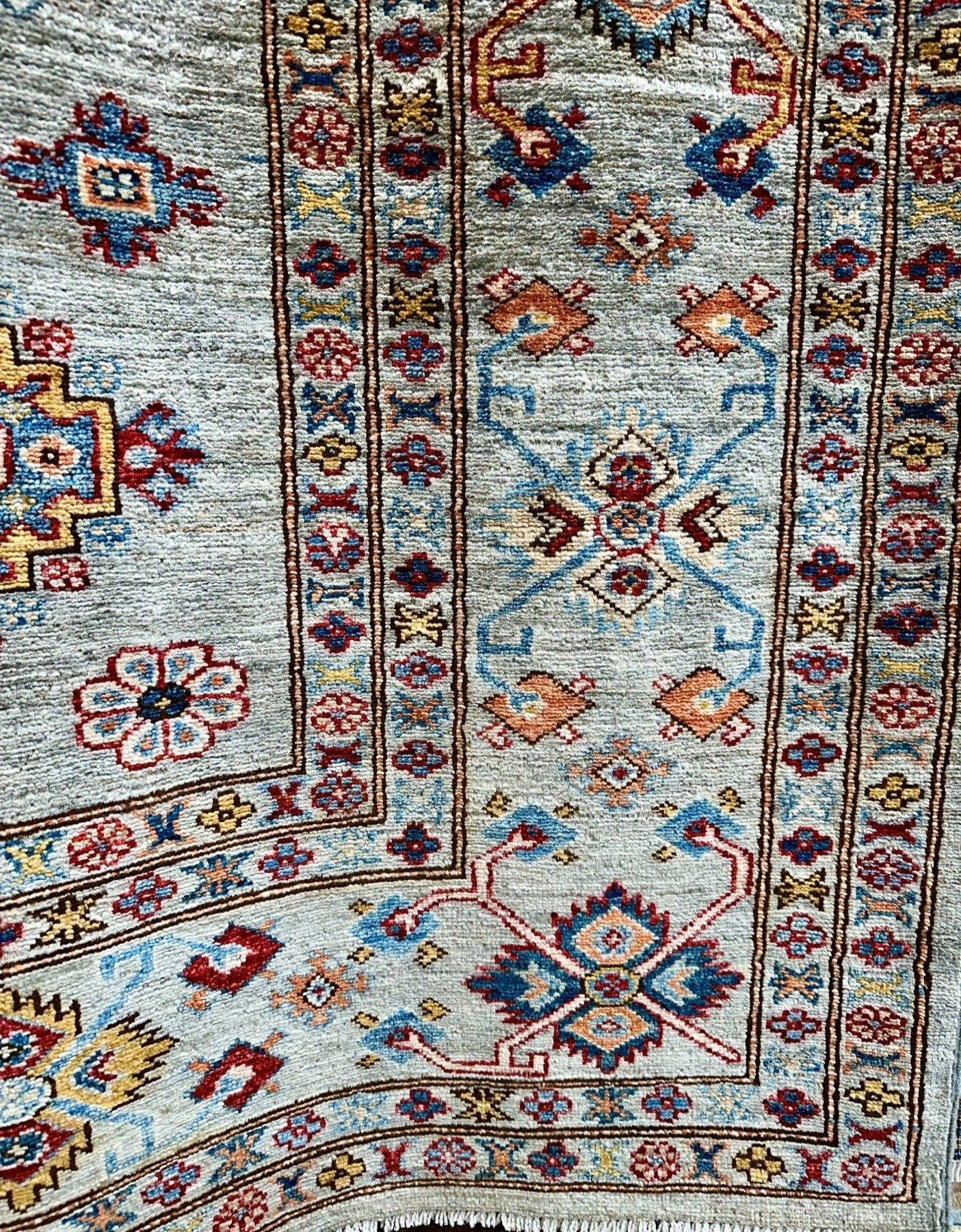 Jewel toned high quality hand-knotted 9x12 rug. Best handknotted rug for cleanability.