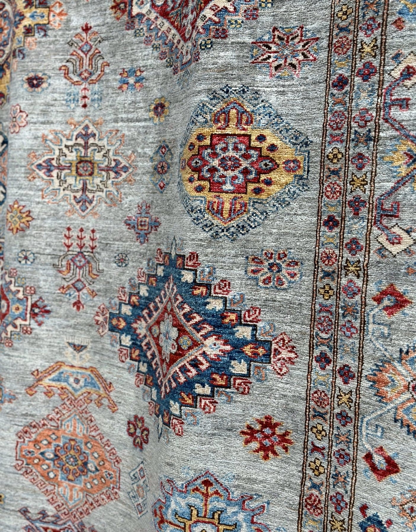 Jewel toned high quality hand-knotted 9x12 rug. Best handknotted rug for cleanability.