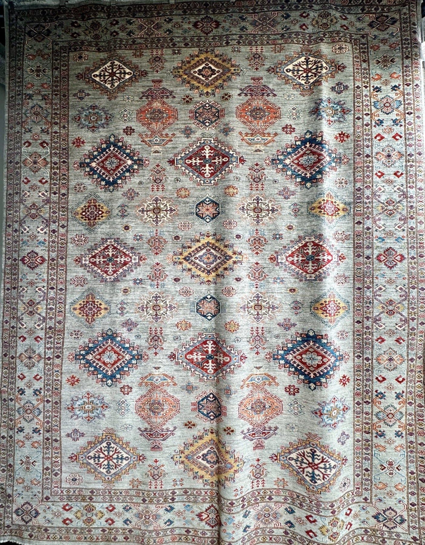 Jewel toned high quality hand-knotted 9x12 rug. Best handknotted rug for cleanability.