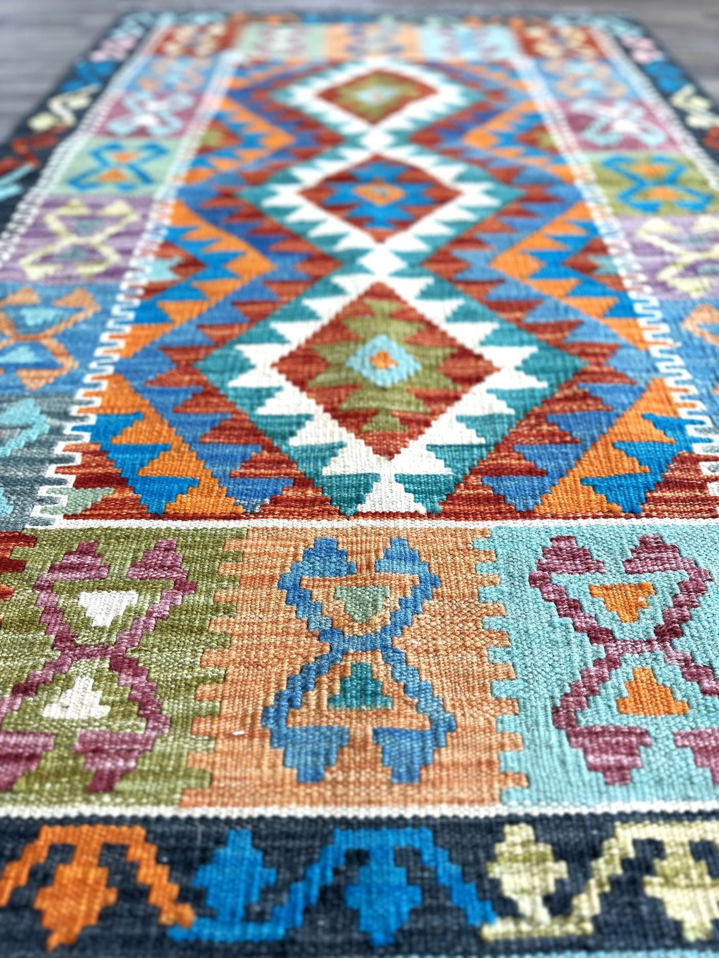 Affordable handknotted rug with geometric pattern. Best flatweave kilim rug with multiple colors of gray, red, yellow, & turquoise.