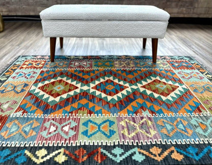 Affordable handknotted rug with geometric pattern. Best flatweave kilim rug with multiple colors of gray, red, yellow, & turquoise.