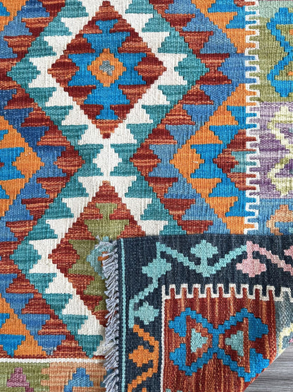 Affordable handknotted rug with geometric pattern. Best flatweave kilim rug with multiple colors of gray, red, yellow, & turquoise.