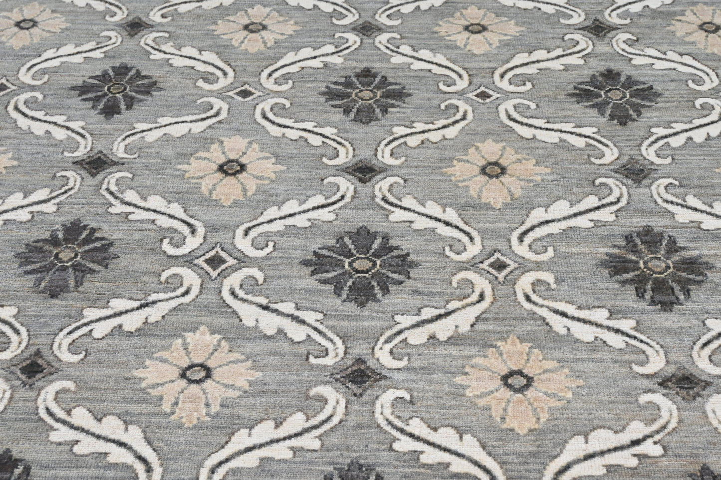 Designer exclusive handknotted rug with repetitive pattern in neutral colors. Size 9 x 12 rug.