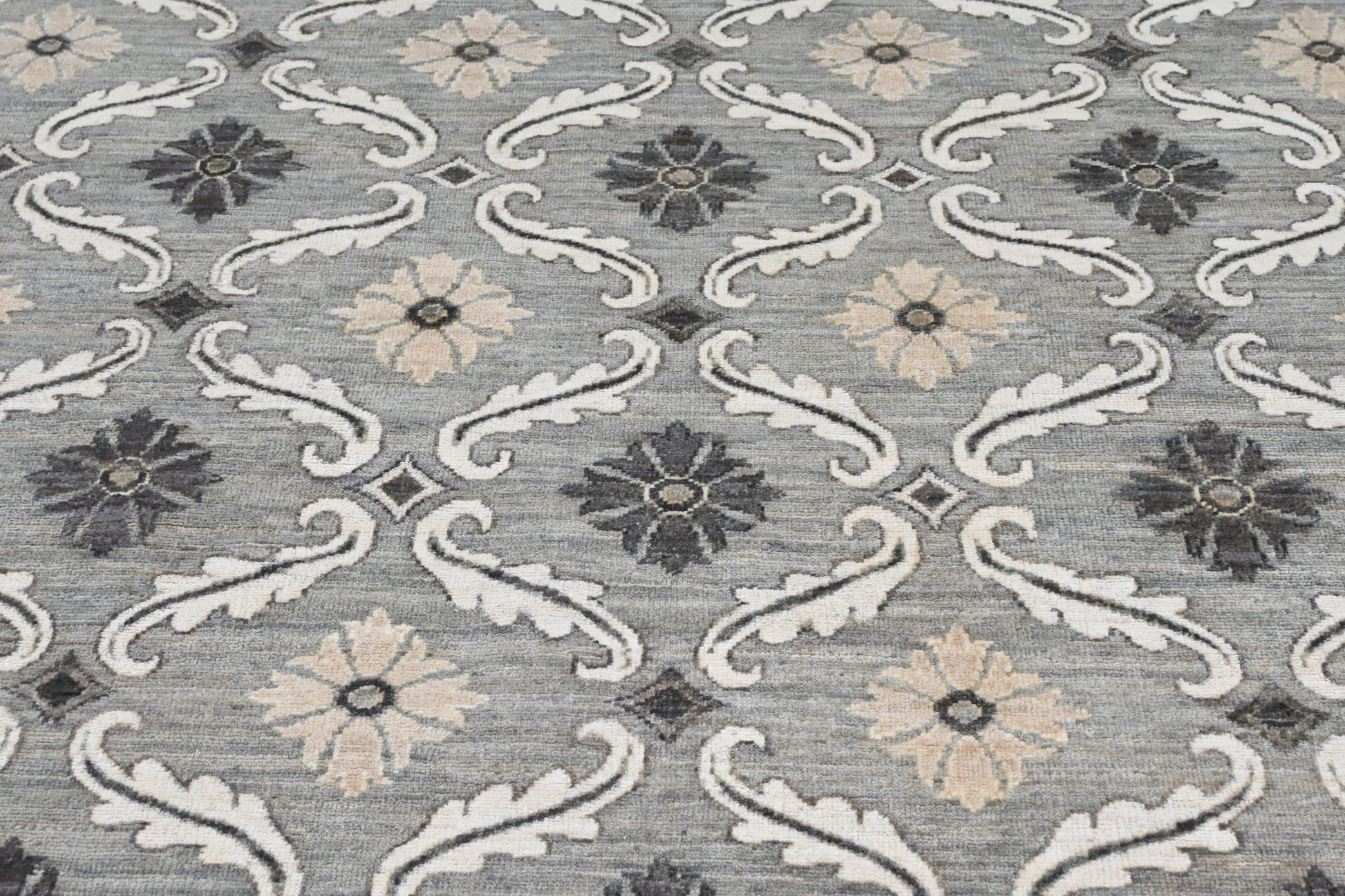 Designer exclusive handknotted rug with repetitive pattern in neutral colors. Size 9 x 12 rug.