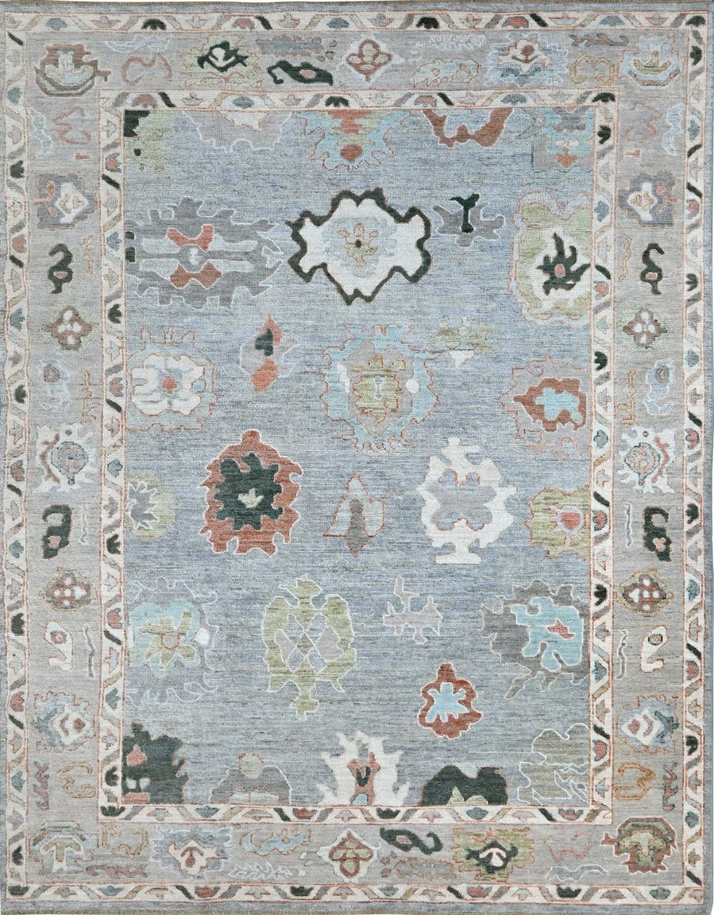 Designer oushak with a blue center and light gray border, size 6 x 9 hand-knotted rug.
