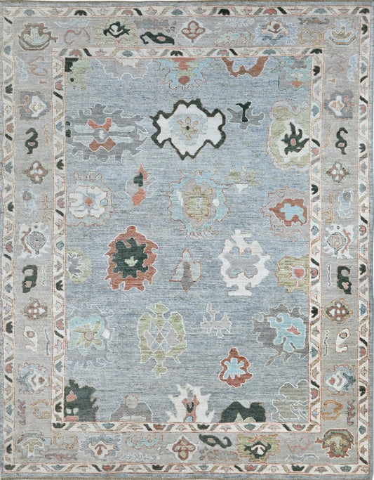 Designer oushak with a blue center and light gray border, size 6 x 9 hand-knotted rug.