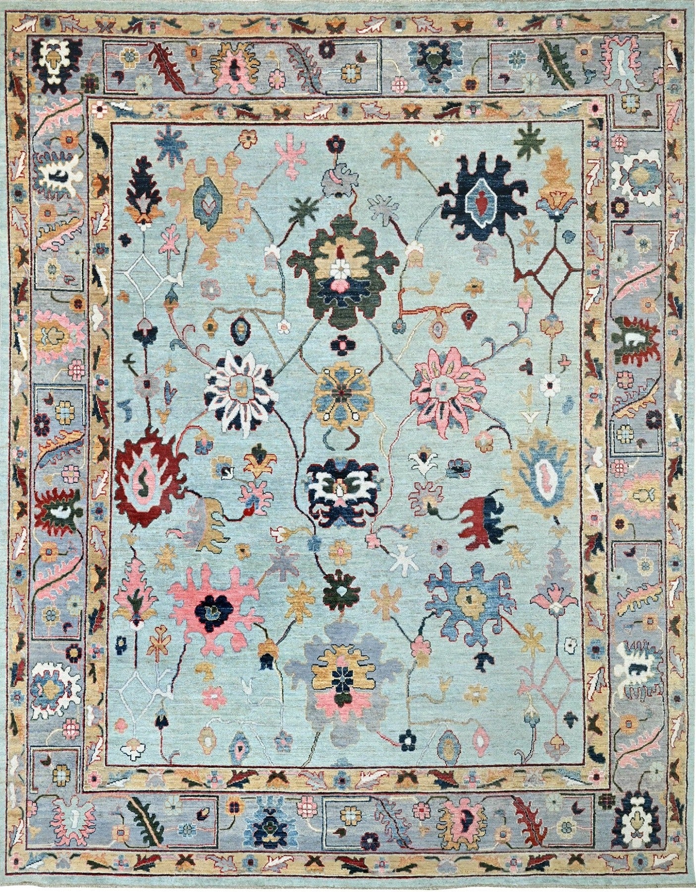 Vibrant wool Oushak rug size 9 x 12 with a blue center and shades of green, coral, blue, gray, and gold.