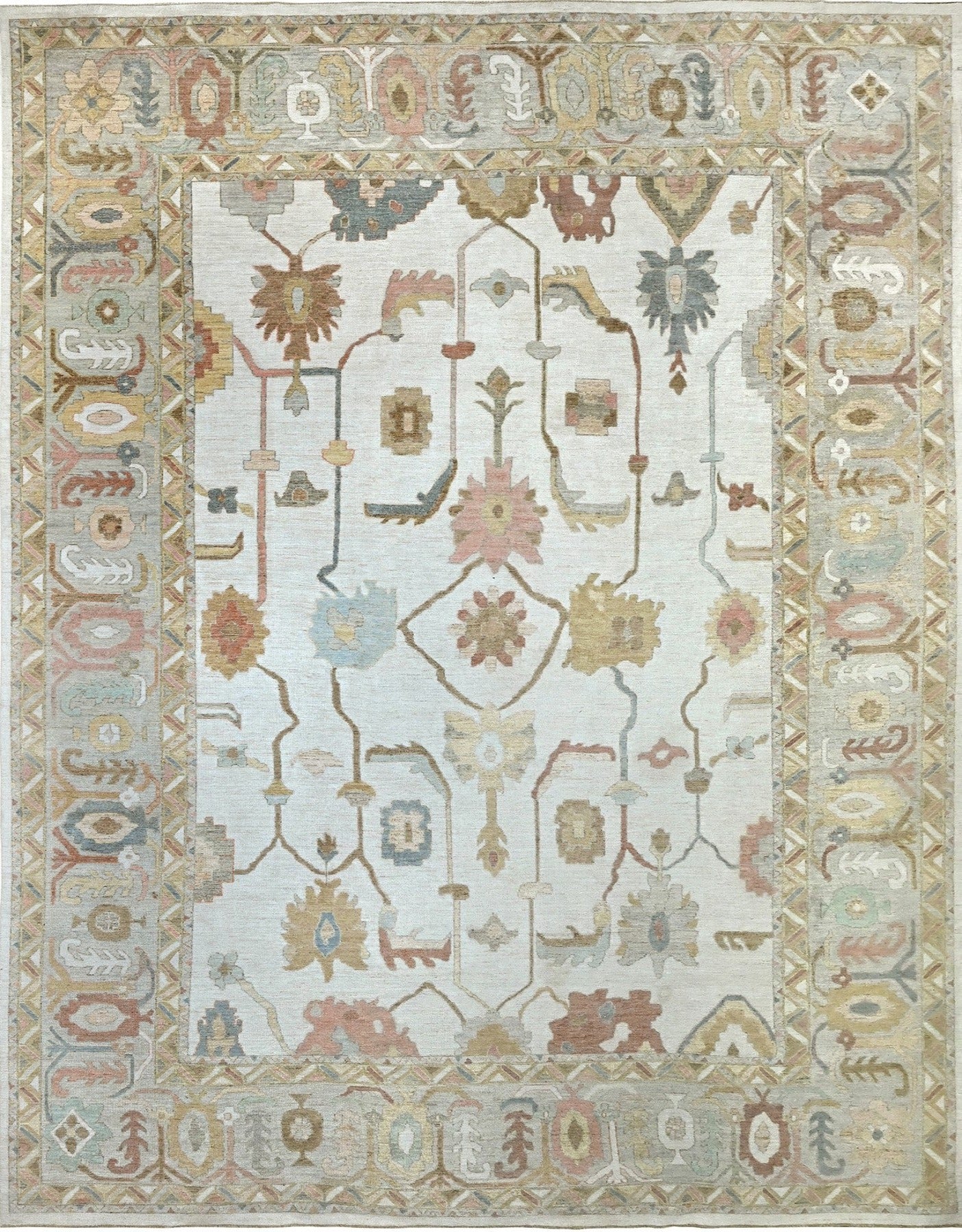 Oversized 13 x 17 handknotted oushak rug in soft, muted colors with a detailed border and overall pattern