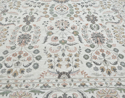Luxury designer handknotted wool rug, light colors with accents of cinnamon, rust, green, and gray. 10 x 14 size.