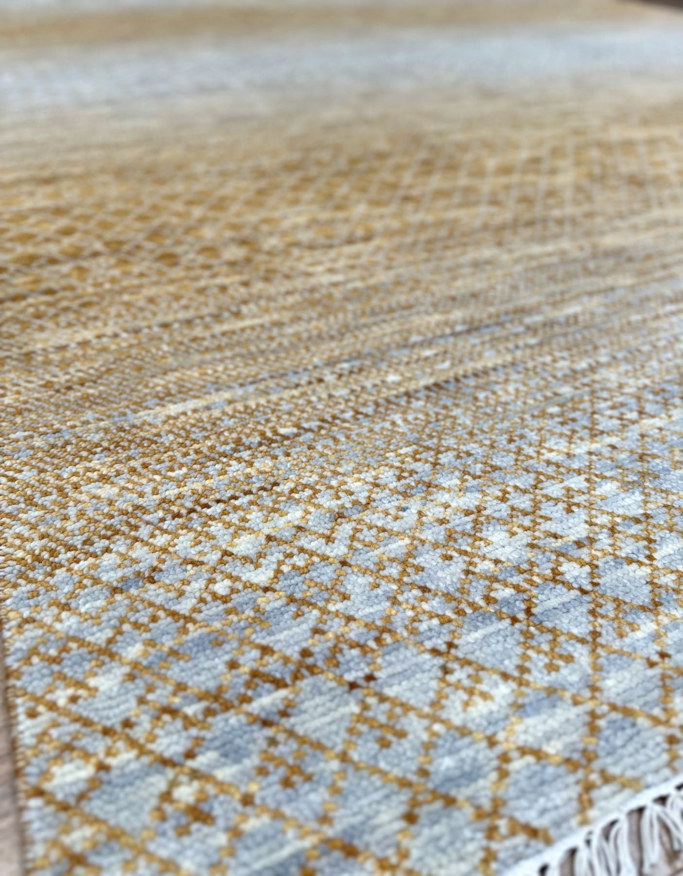 Luxury wool handknotted rug in textural pattern with golden and gray tones