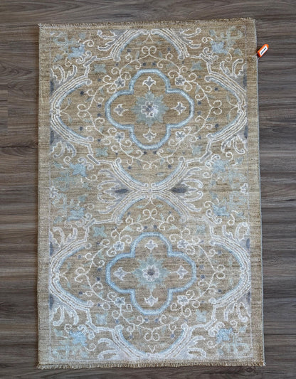 Knotted Couture luxury hand knotted wool rug geometric tan and blue 